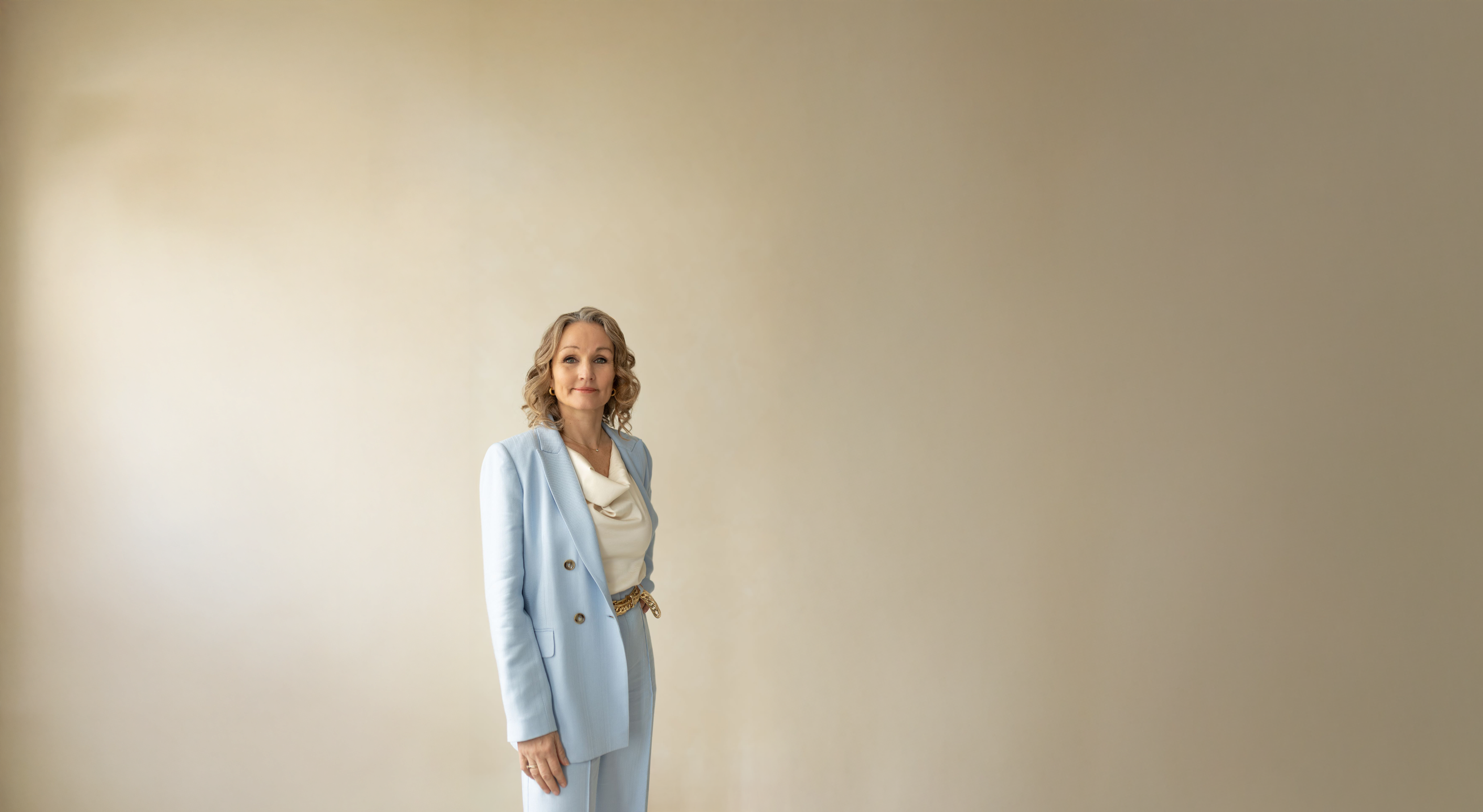 Lene Gerlach in a pale blue suit